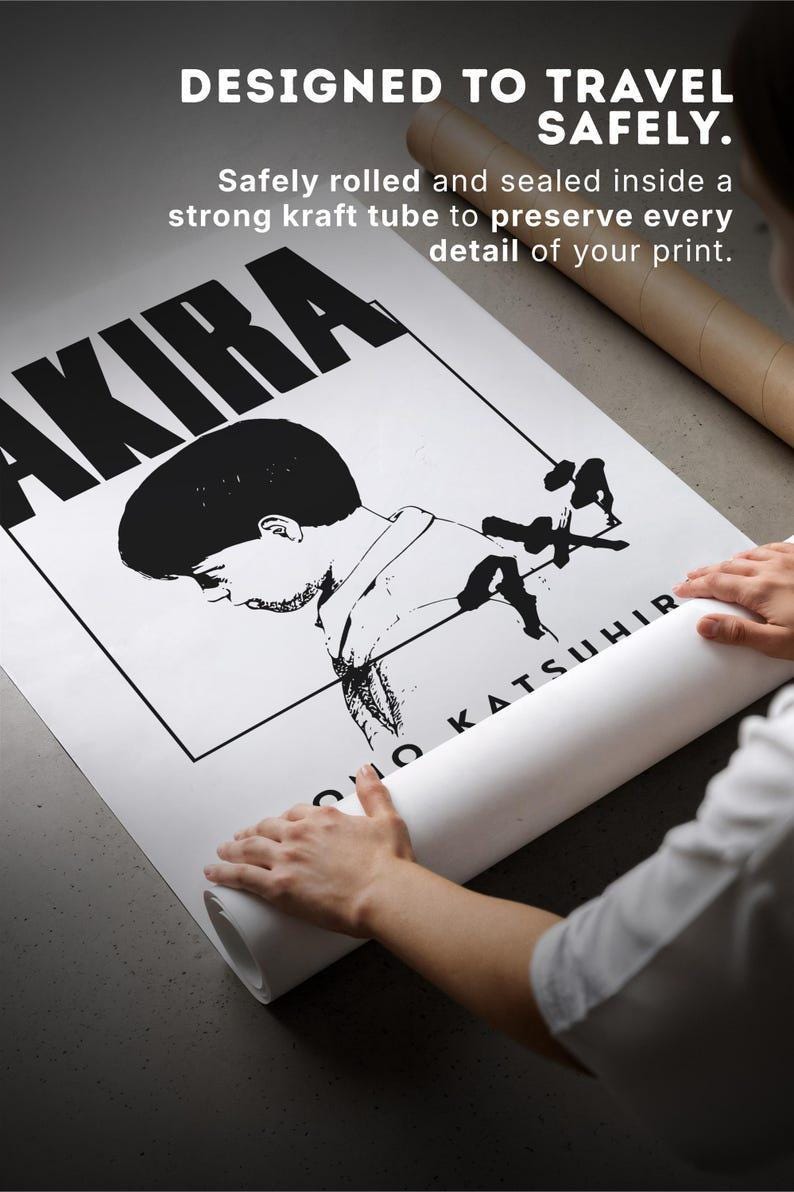 A person is rolling up a poster featuring a character from the anime series "Akira".