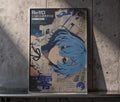 The image is a poster featuring an anime-style illustration of a character with blue hair and a serious expression. The poster is framed and displayed on a shelf against a concrete wall.