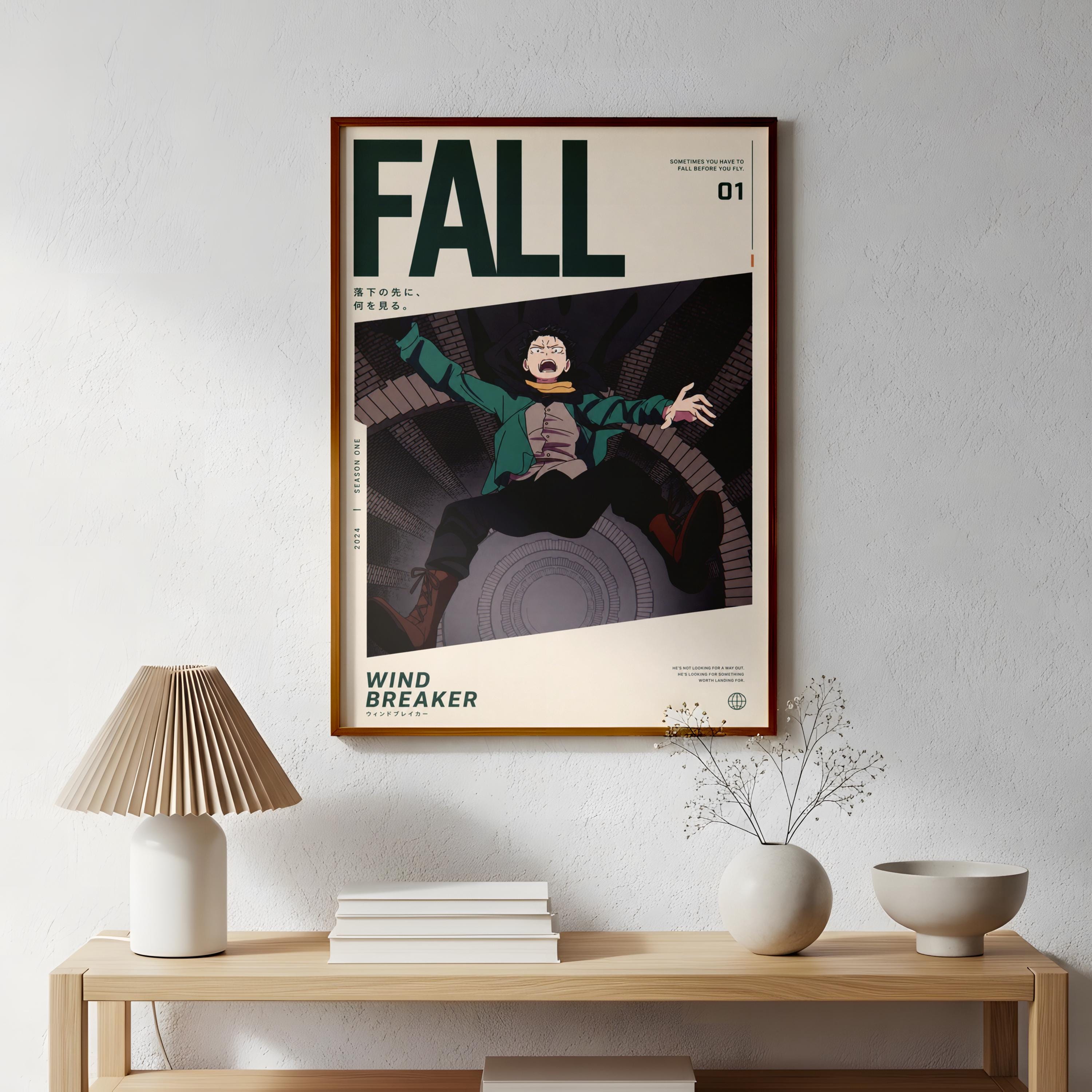 a framed poster of a character from the anime series "Windbreaker" hanging on a wall above a wooden table with various decorative items, such as a lamp, a vase, and a stack of books.