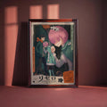 The image is a framed poster featuring an anime-style illustration of three characters, with a pink-haired character in the center. The poster has Japanese text and an orange and black color scheme.